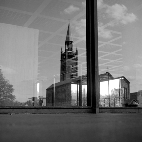 Reflection of church in New National Gallery window, Berlin.